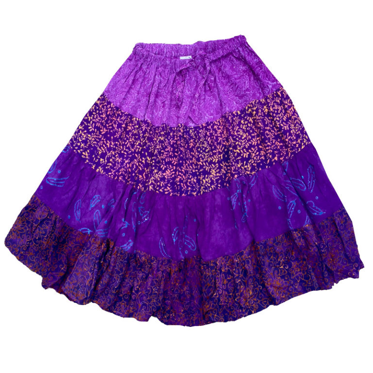 A purple skirt with gold print and ruffle.