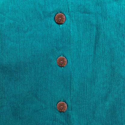 A close up of three buttons on the front of a jacket.