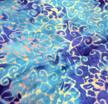 A blue and yellow fabric with swirls